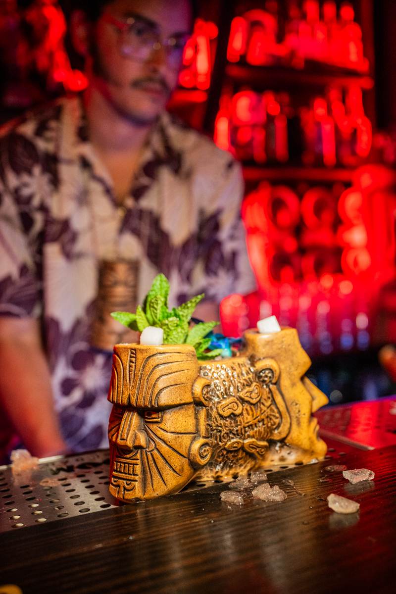 Tiki mug cocktail with bartender